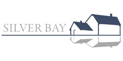 Silver Bay logo with silver lettering and outline of a house