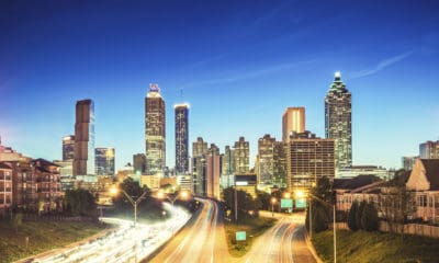 A night time shot of highways and city high rises.